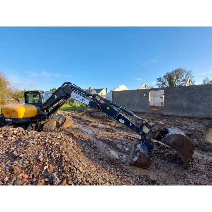 Excavator digging footings at barn conversion, Ashill, Somerset