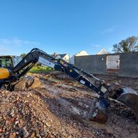 Excavator digging footings at barn conversion, Ashill, Somerset