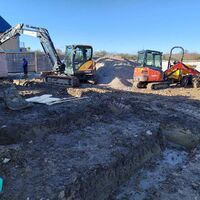 Excavators preparing foundations for barn conversion, Ashill, Somerset