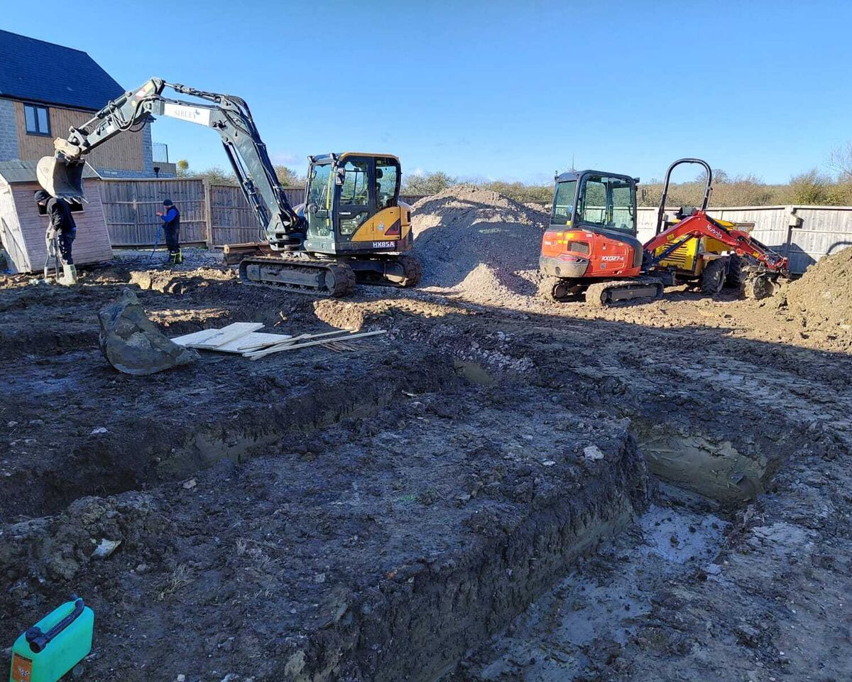 Excavators preparing foundations for barn conversion, Ashill, Somerset